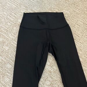 black shiny lululemon wonder train leggings